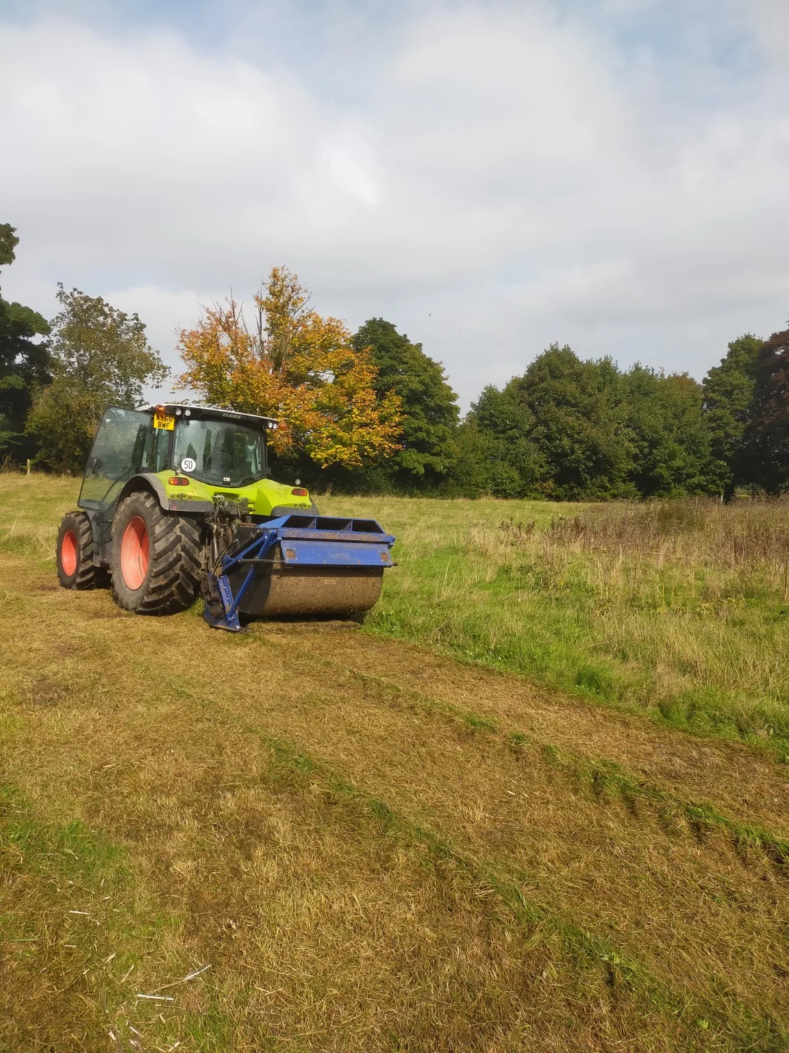 Tractor rolling grassland